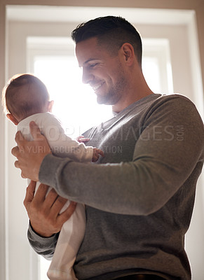 Buy stock photo Father and baby, love and happy in a house with care, trust and child development, support or bonding. Family, security and dad with kid at home for learning, safety or morning games with gratitude