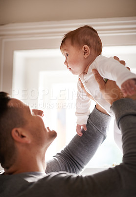 Buy stock photo Father, baby and home with bonding, love and support together with family care and development. Dad, smile and young child in a house with parent playing with newborn and happy about infant growth 