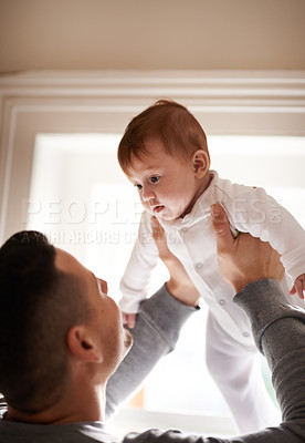 Buy stock photo Love, hug or father lifting baby in a house with care, trust and child development, support or bonding. Family, security and dad with kid at home for learning, safety or morning games with gratitude