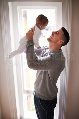 Buy stock photo Father, baby in air and bonding, happy with love for growth and child development with joy at family home. Man, infant or newborn with smile and dad holding kid for comfort, childhood and parenting 