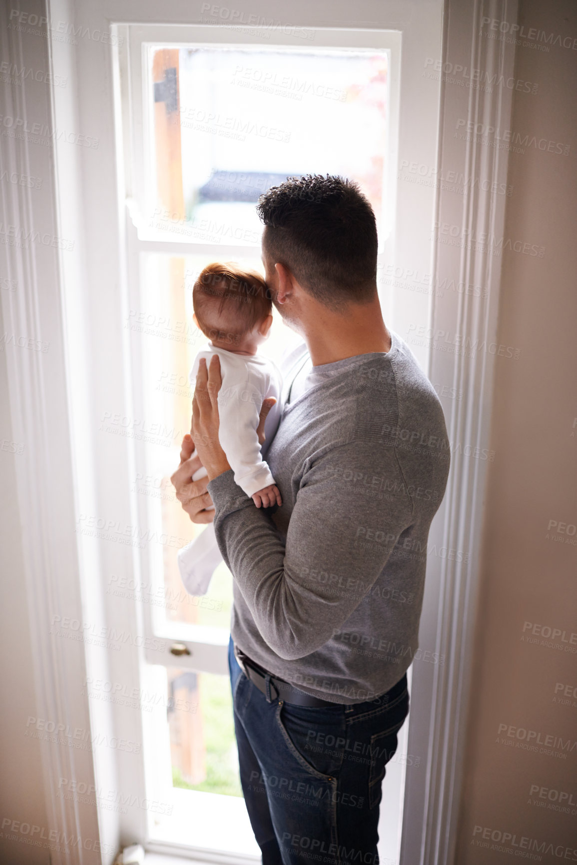 Buy stock photo Father, baby and bonding with love and window, growth and child development with view at family home. Man, infant or newborn with back and dad holding kid for comfort, childhood and parenting 