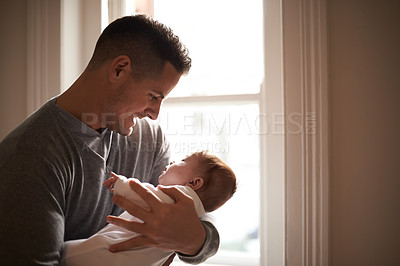 Buy stock photo Father, baby and bonding with love and pride, growth and child development with happiness at family home. Man, infant or newborn with smile and dad holding kid for comfort, childhood and parenting 