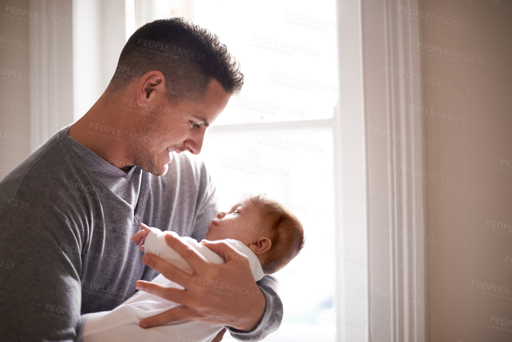 Buy stock photo Father, baby and home window with care, love and support together with family bonding and development. Dad, smile and young child in a house with kid and parent happy and proud about infant growth