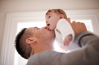 Buy stock photo Kiss, love or father and baby in a house with care, trust and child development, support or bonding. Family, security and dad hug kid at home for learning, safety or morning games with gratitude