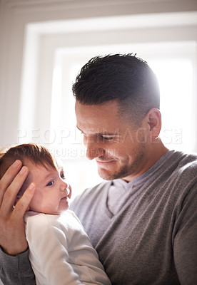 Buy stock photo Father, baby and bonding with happiness and pride, growth and child development with love at family home. Man, infant or newborn with smile and dad holding kid for comfort, childhood and parenting 