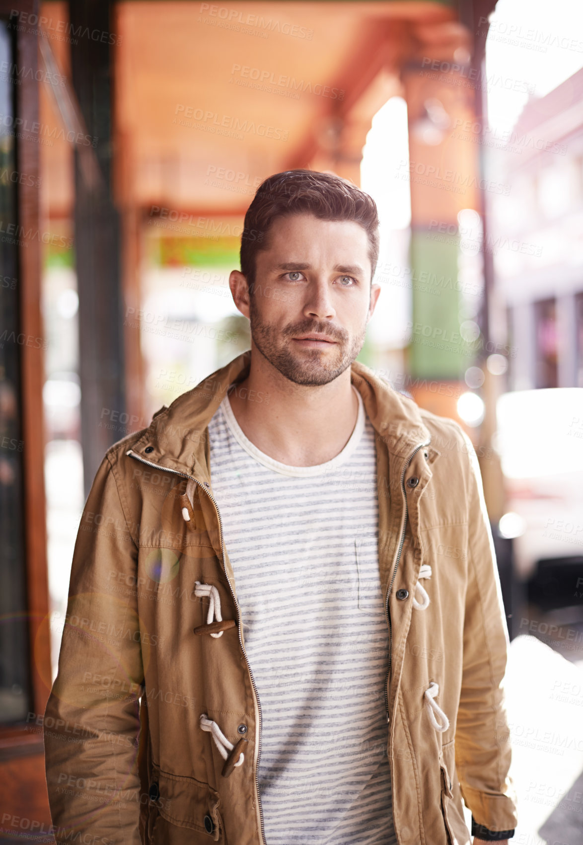 Buy stock photo Cropped shot of a serious man walking down the street