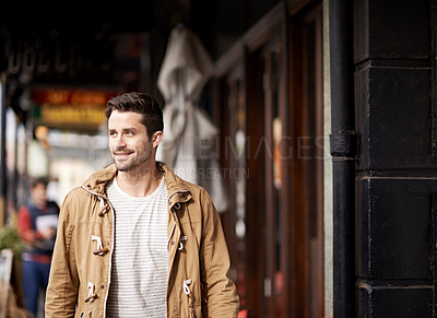 Buy stock photo Man, face and happiness in city with fashion by restaurant with urban style, trendy outfit and confidence. Male person, smile and relax outdoor in town with walking, casual clothes and morning trip