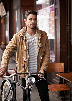 Buy stock photo Sidewalk, cafe and man with bicycle walking in city, thinking and eco friendly transport. Carbon neutral, sustainability and tourist on street for urban journey, morning travel and male with bike