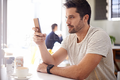 Buy stock photo Man in cafe, smartphone and scroll on social media, reading on mobile app or ebook with communication and contact. Chat, email or text message with tech, search internet and online at coffee shop