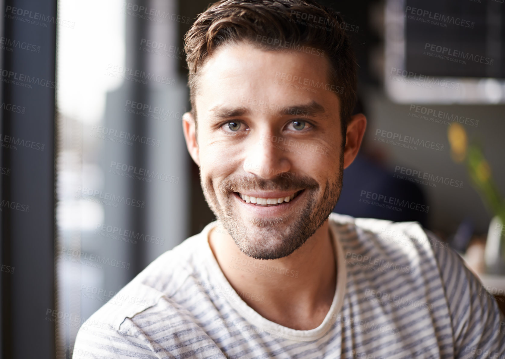 Buy stock photo Handsome man, face and portrait with smile at cafe for morning, ambition or pride at indoor restaurant. Attractive, young or happy male person with positive attitude, beard or mindset at coffee shop