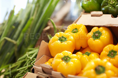 Buy stock photo Shot of a fresh yellow peppers in a supermarket