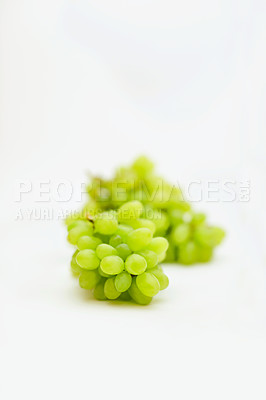 Buy stock photo Fruit, green grapes and healthy food in studio for art and creativity for nutritionist. Fruits, wellness diet and nutrition with clean, vegan or grape snack isolated on a white background for health