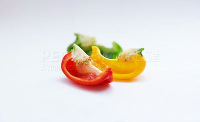 Buy stock photo Vegetable, color and healthy food in studio with peppers, art and creativity for nutritionist. Cooking, wellness diet and nutrition with clean, green or vegan meal isolated on a white background