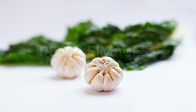 Buy stock photo Vegetable, garlic clove and healthy food in studio as art or creativity for nutritionist. Cooking, wellness diet and nutrition for clean, green or vegan meal ingredient isolated on a white background