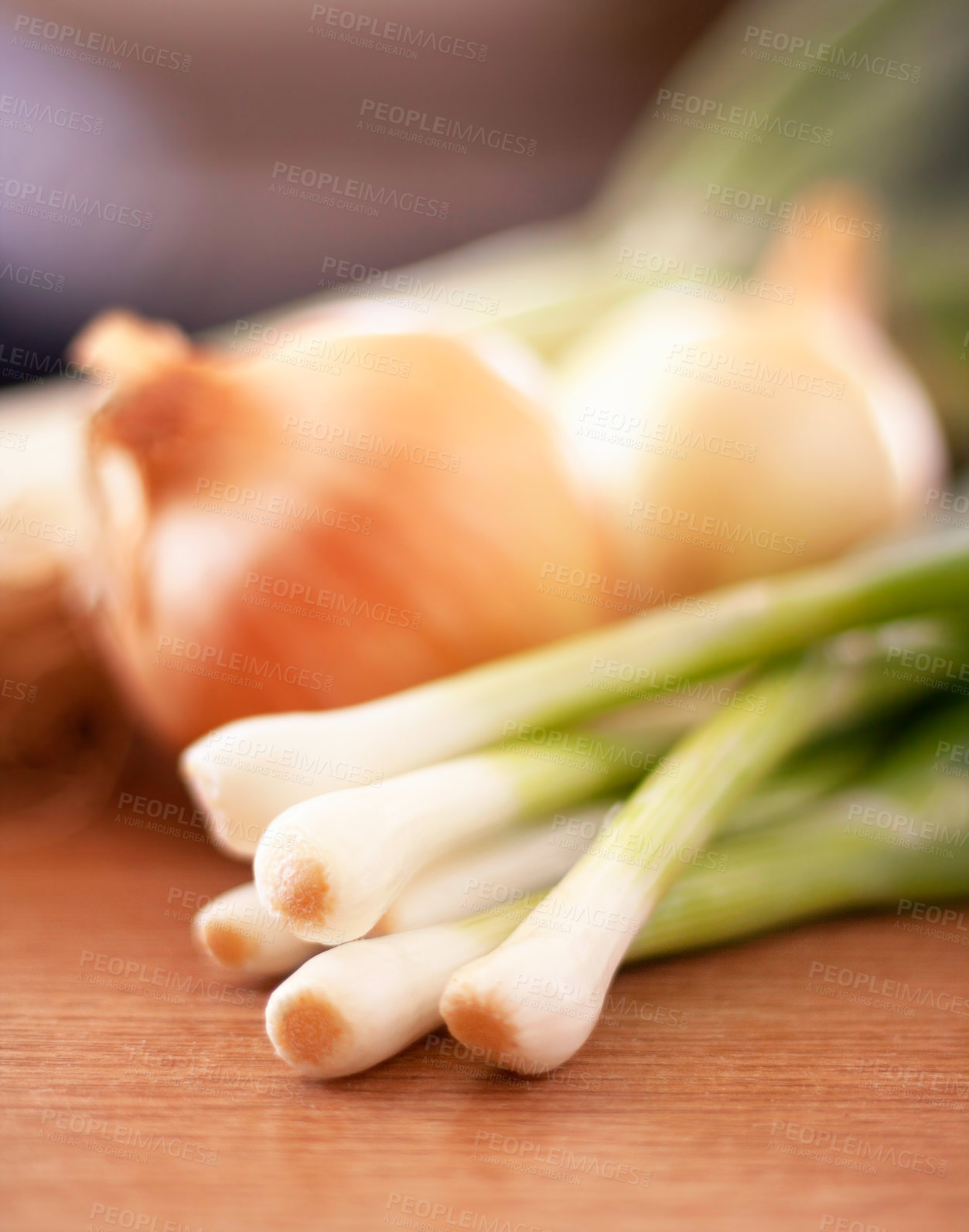 Buy stock photo Shot of various types of onions lying on a countertop.