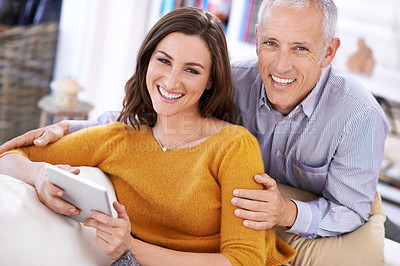 Buy stock photo Couple, portrait and laughing with tablet on sofa with hug for bonding, love and relax with social media or funny joke. Senior man, woman and happy with technology for subscription or embrace in home
