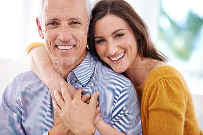 Buy stock photo Couple, age difference and hug for love with unique relationship, portrait and support for trust at home. Senior man, young woman and marriage, commitment and loyalty with partner and pride together