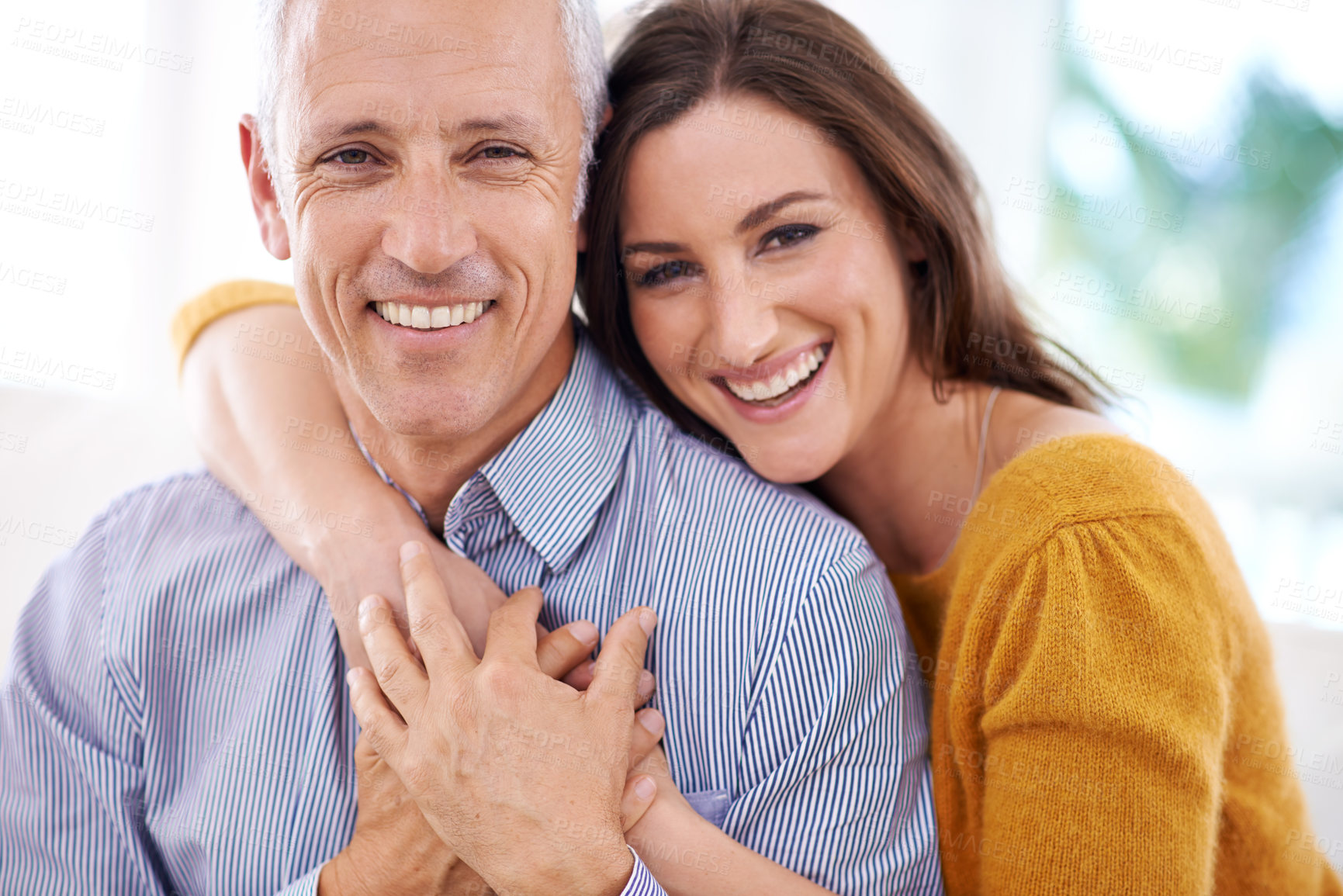 Buy stock photo Couple, age difference and hug for love with unique relationship, portrait and support for trust at home. Senior man, young woman and marriage, commitment and loyalty with partner and pride together