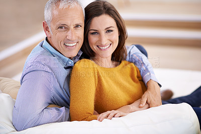 Buy stock photo Couple, portrait and happy on sofa with hug for support, trust and comfort in living room of house. Senior man, woman and smile with face for embrace, affection and healthy relationship in apartment
