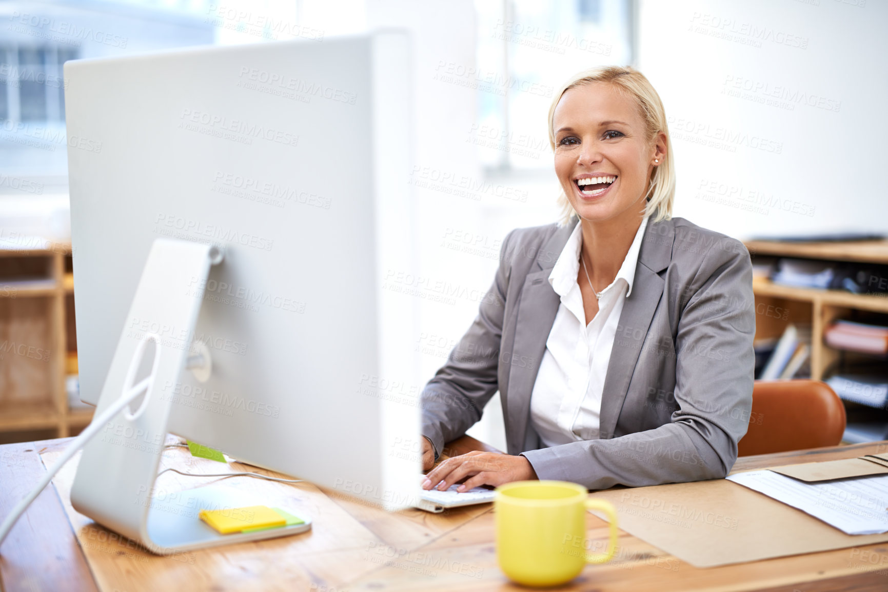 Buy stock photo Lawyer, woman and portrait by computer with smile for legal services with pride, knowledge and typing. Attorney, advocate and person by office pc for writing, excited and happy at law firm in Canada