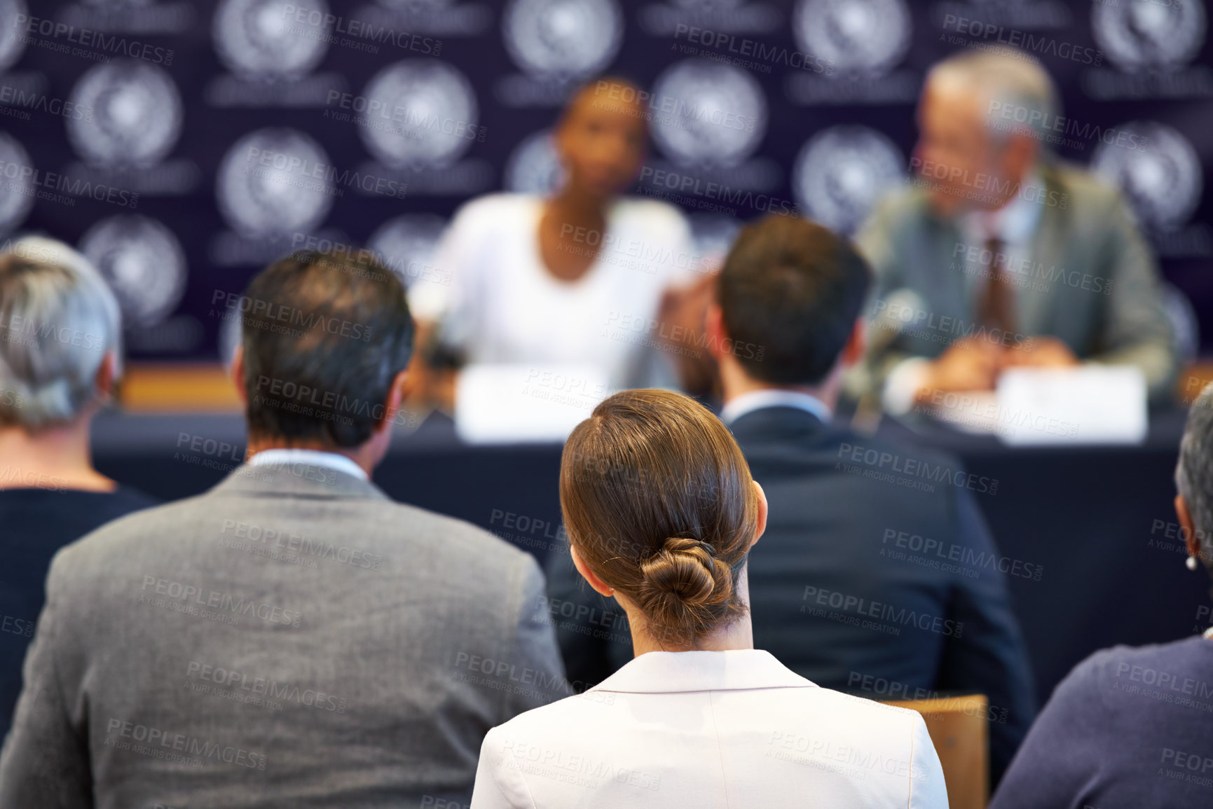 Buy stock photo Shot of a group of businesspeople in a press conference