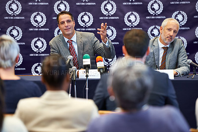 Buy stock photo Politician men, press conference and news interview with journalist group in audience for questions. People, talking and story with information for public relations, seminar and discussion with crowd