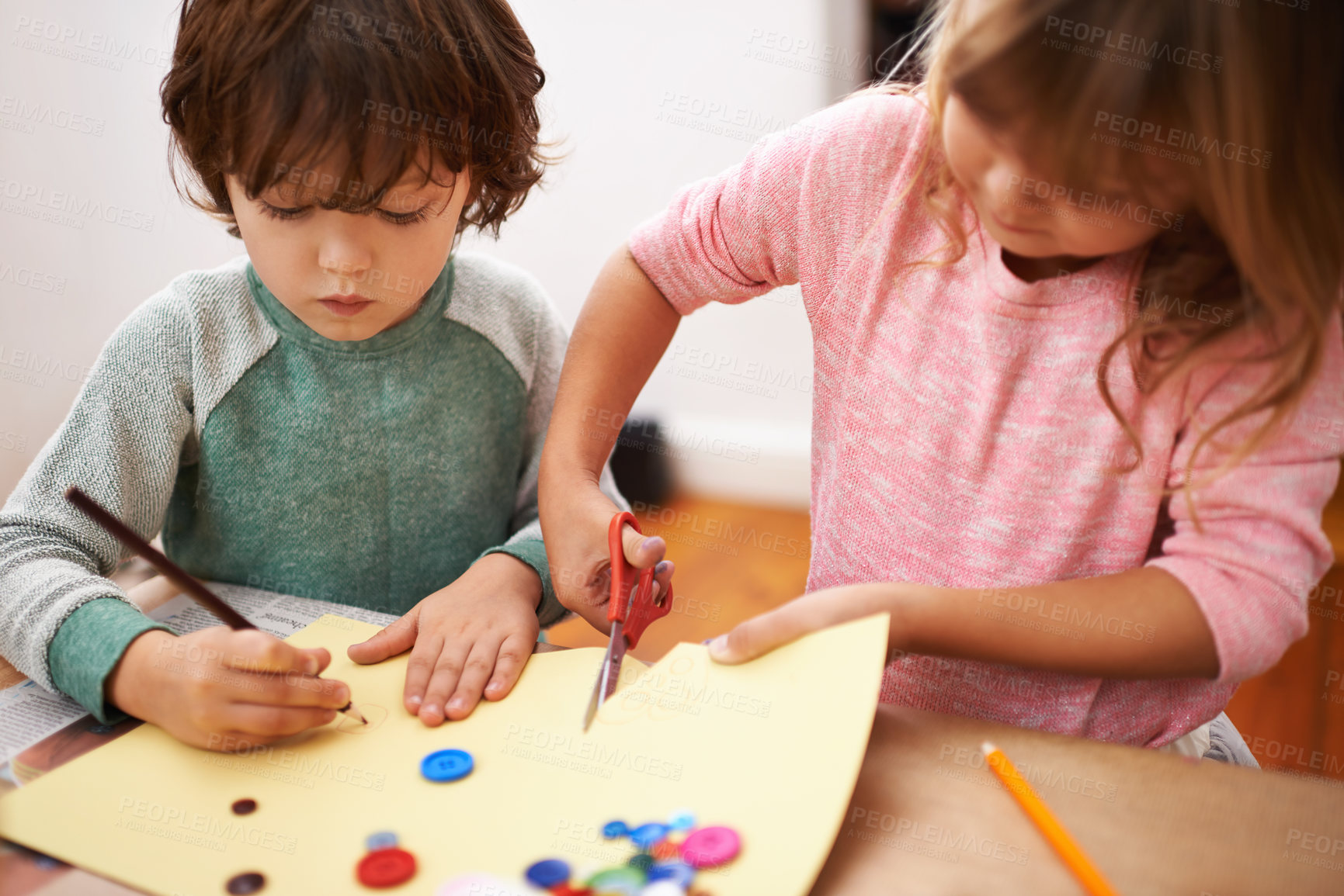 Buy stock photo Cropped shot of two siblings cutting and drawing