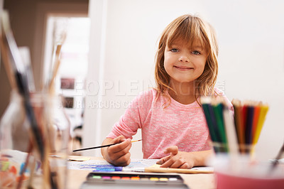 Buy stock photo Happy child, portrait and drawing with color for creativity, learning or education at home. Young girl with paintbrush for sketching, writing or artwork in early childhood development at the house