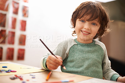 Buy stock photo Happy boy, portrait and drawing with color for creativity, learning or education at home. Young child with smile and pencil for sketching, writing or artwork in early childhood development at house