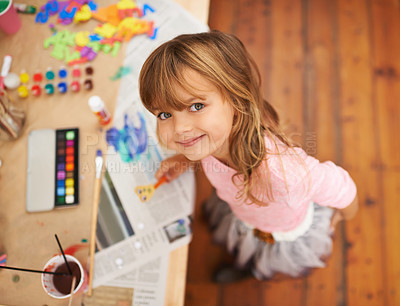 Buy stock photo Shot of an adorable little girl doing arts and crafts