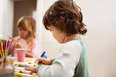 Buy stock photo Child, writing and drawing with colorful art at home for learning, education or creativity. Young boy with color pencil for sketching, activity or artwork in early childhood development at the house