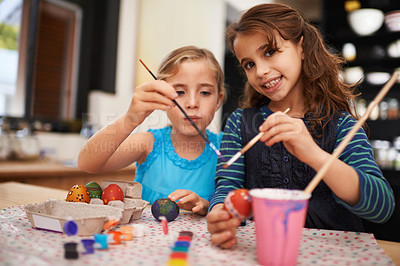 Buy stock photo Girl, sister and portrait for painting easter eggs with bonding, connection and festive decoration in home. Children, paintbrush and creativity with art, love or together for learning in family house
