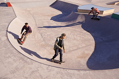 Buy stock photo Friends, sports and men with skateboard, ramp or bowl action at a skate park for stunt training. Freedom, adrenaline and gen z skater people with energy, balance or skill, exercise or performance