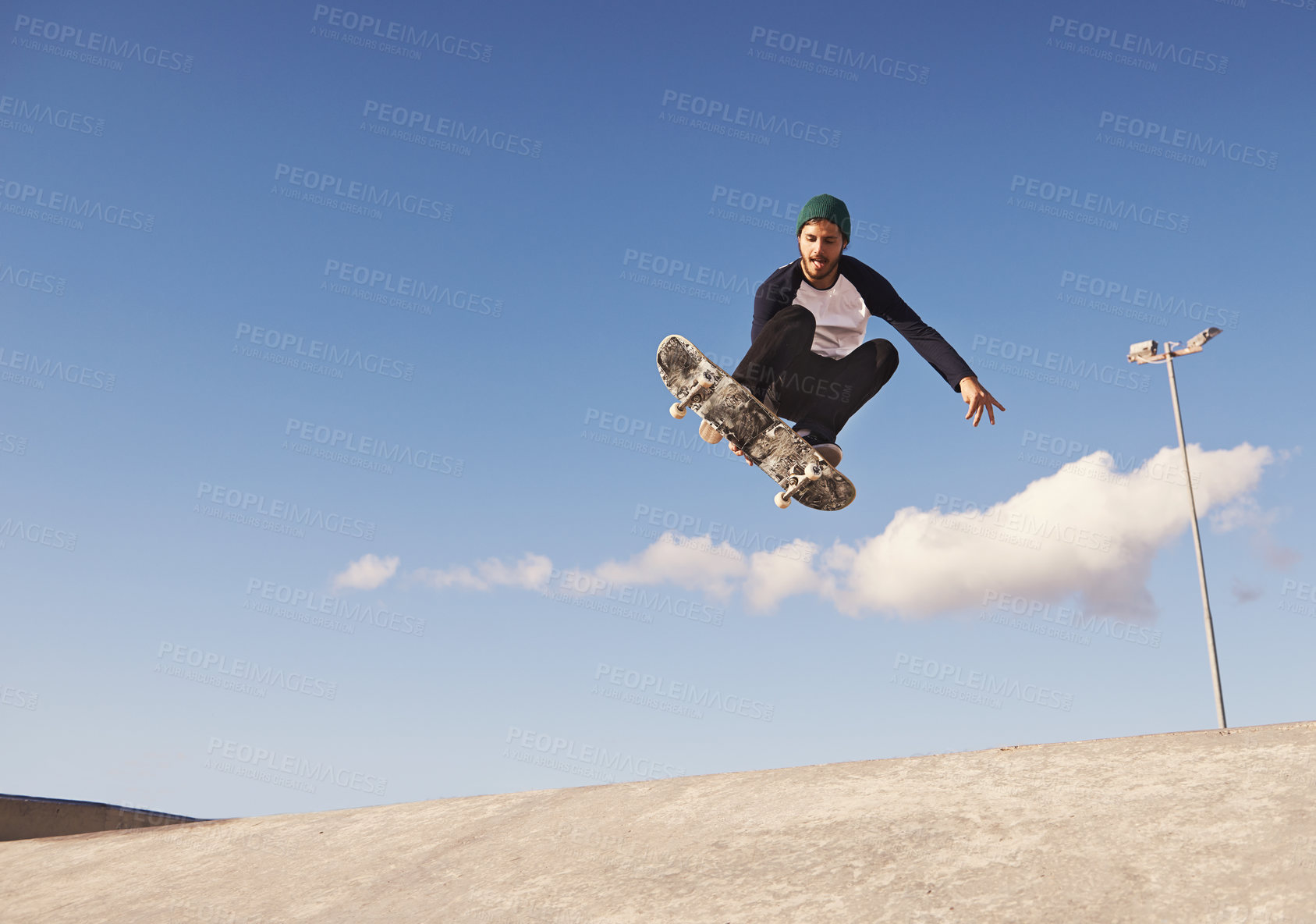 Buy stock photo Skateboard, blue sky and man with ramp, challenge and training for a competition, talent and sunshine. Adventure, person and skater with practice for technique or balance with fitness, energy or jump