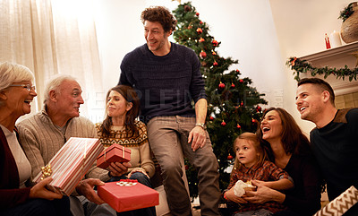 Buy stock photo Christmas, family and gift for happiness, joy and bonding together with smile, laugh and talking. Xmas, grandparents and siblings talking, presents and celebration for holiday, vacation and festive.
