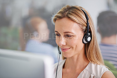 Buy stock photo Cropped portrait of an attractive blonde female wearing headsets at work