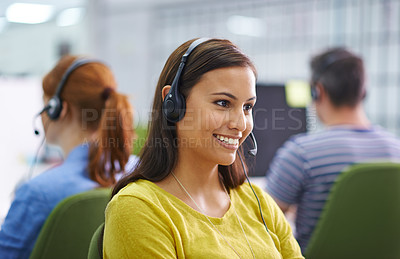 Buy stock photo Shot of an attractive female at work wearing headsets