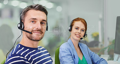 Buy stock photo Portrait of two business colleagues wearing headsets in the office