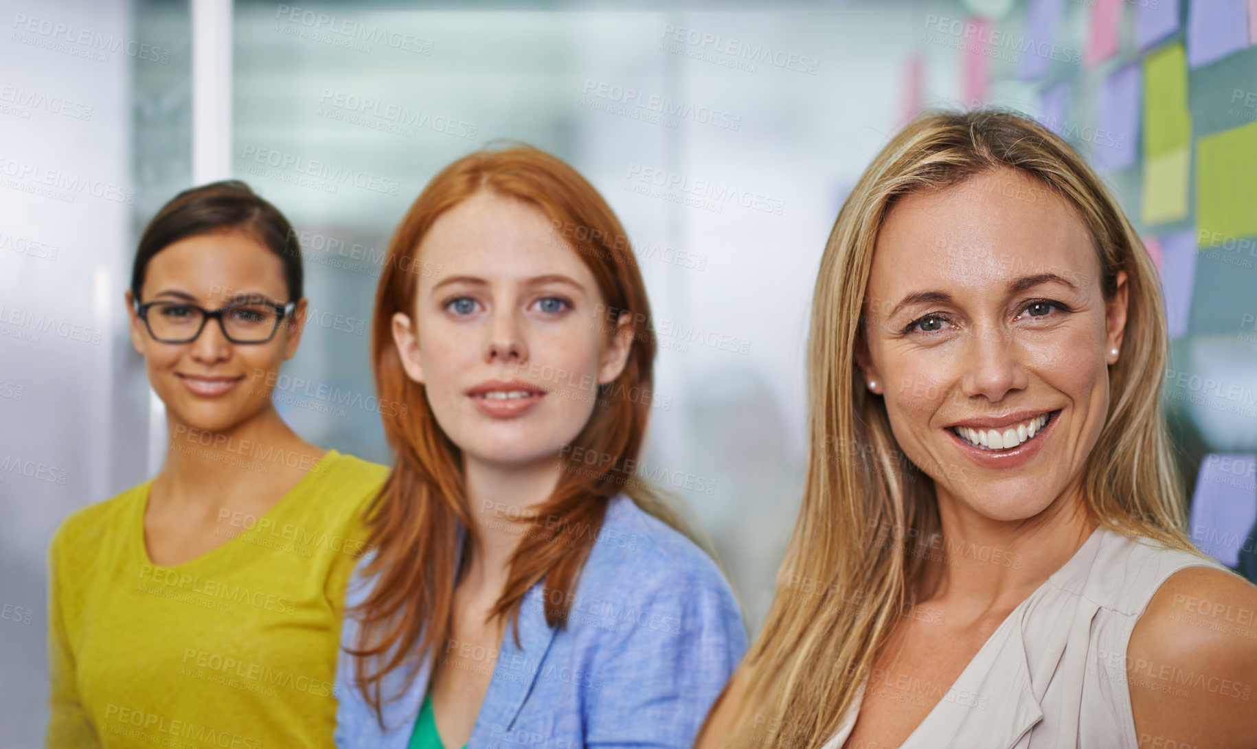 Buy stock photo Three attractive female colleagues ready for the working day