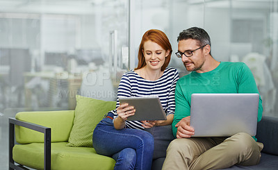 Buy stock photo Two colleagues working together in the office