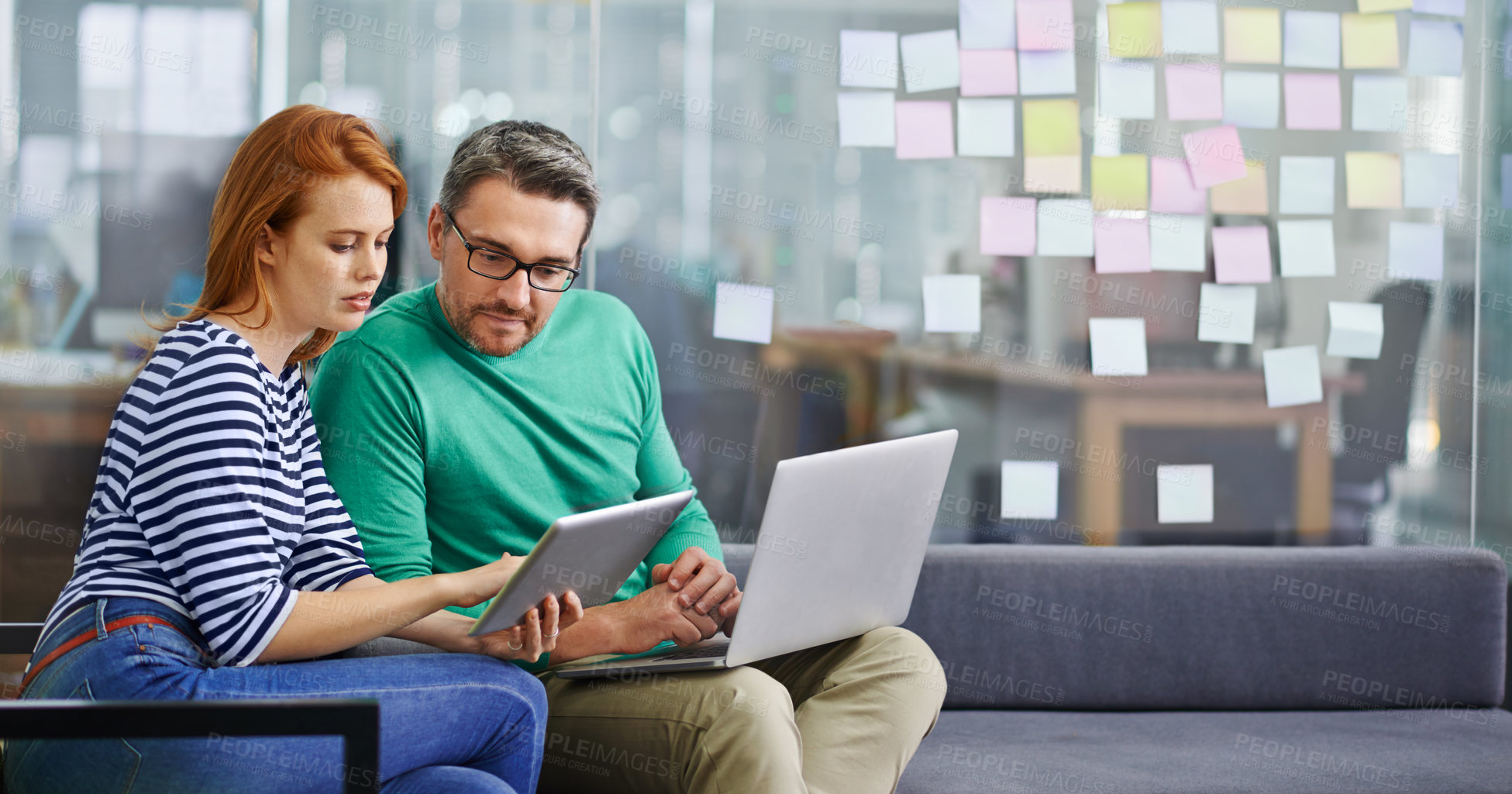 Buy stock photo An attractive female coworker asking her colleague for advice