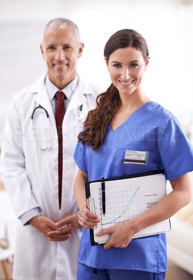 Buy stock photo Doctor, nurse and portrait with partner, smile or documents for chart to monitor wellness in hospital. Medic, man and woman in team with paperwork for healthcare services in clinic with pride for job