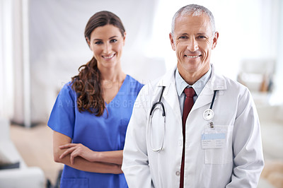 Buy stock photo Doctors, man and woman in portrait with smile for medical support, wellness and arms crossed in hospital. Medic, surgeon and nurse in team, happy and health services in clinic with pride for career