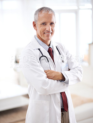 Buy stock photo Portrait, medicine and doctor man with arms crossed in hospital for support, services and wellness. Healthcare, lens flare and happy mature medical professional for confident, smile and treatment