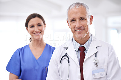 Buy stock photo Doctors, man and woman in portrait at clinic for medical support, wellness and partnership with smile. Mature medic, people and nurse in team, happy or health services at hospital for pride in career