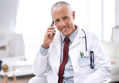 Buy stock photo Doctor, man and call with smartphone in hospital for Consultation, conversation or healthcare results. Clinic, smile and mature medic by mobile for communication, discussion or medical insurance