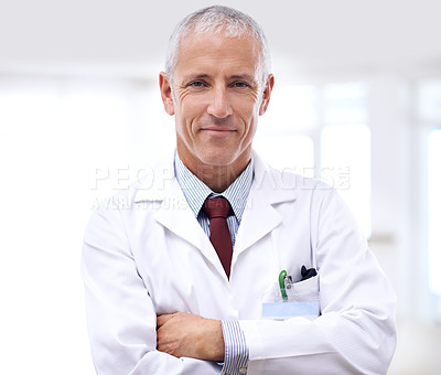Buy stock photo Healthcare, portrait of man doctor with arms crossed and in a hospital. Medical health wellness, specialist or stand and confident professional mature male surgeon or nurse at clinic for support