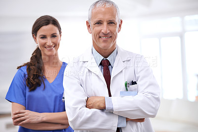 Buy stock photo Doctors, man and woman in portrait with arms crossed for health, wellness and team in hospital. Mature healthcare expert, nurse and professional with medical knowledge, solidarity and smile in clinic