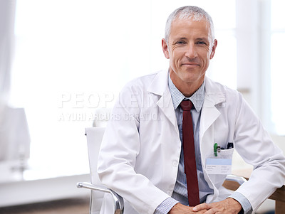 Buy stock photo Portrait of a male doctor sitting in his office