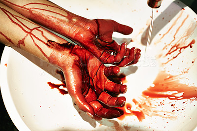 Buy stock photo A cropped shot of a woman washing blood from her hands in a basin